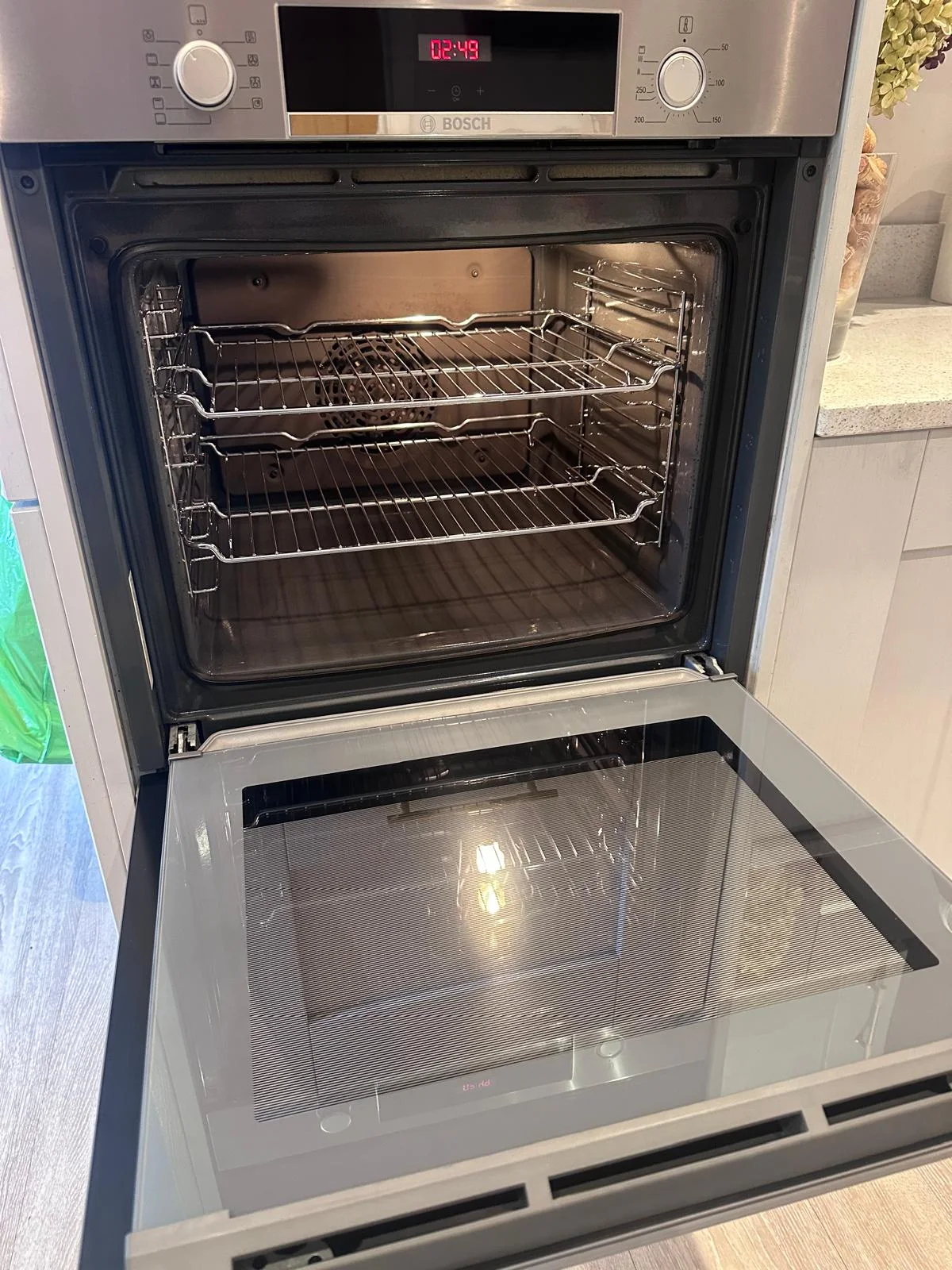 Clean built-in single oven cavity, shelves, and door glass after cleaning in Ebrington