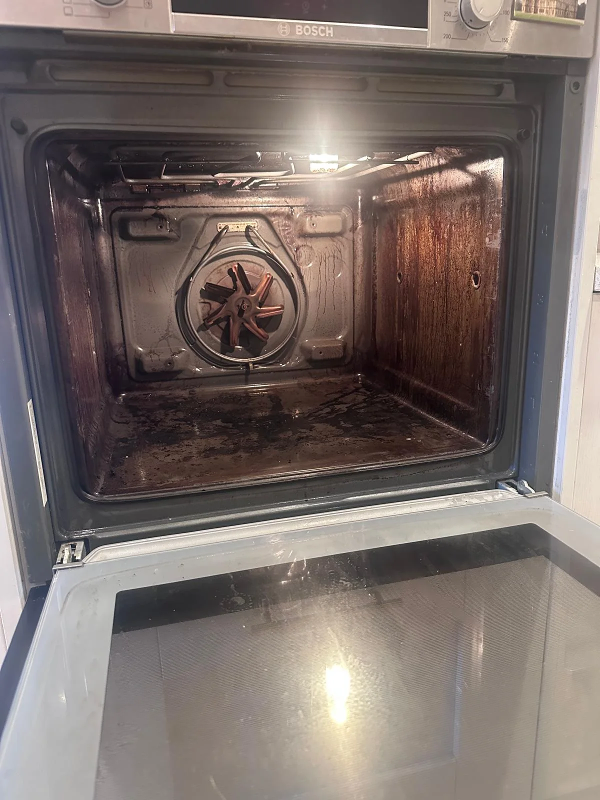 Built-in single oven with grease and baked-on residue before cleaning in Ebrington